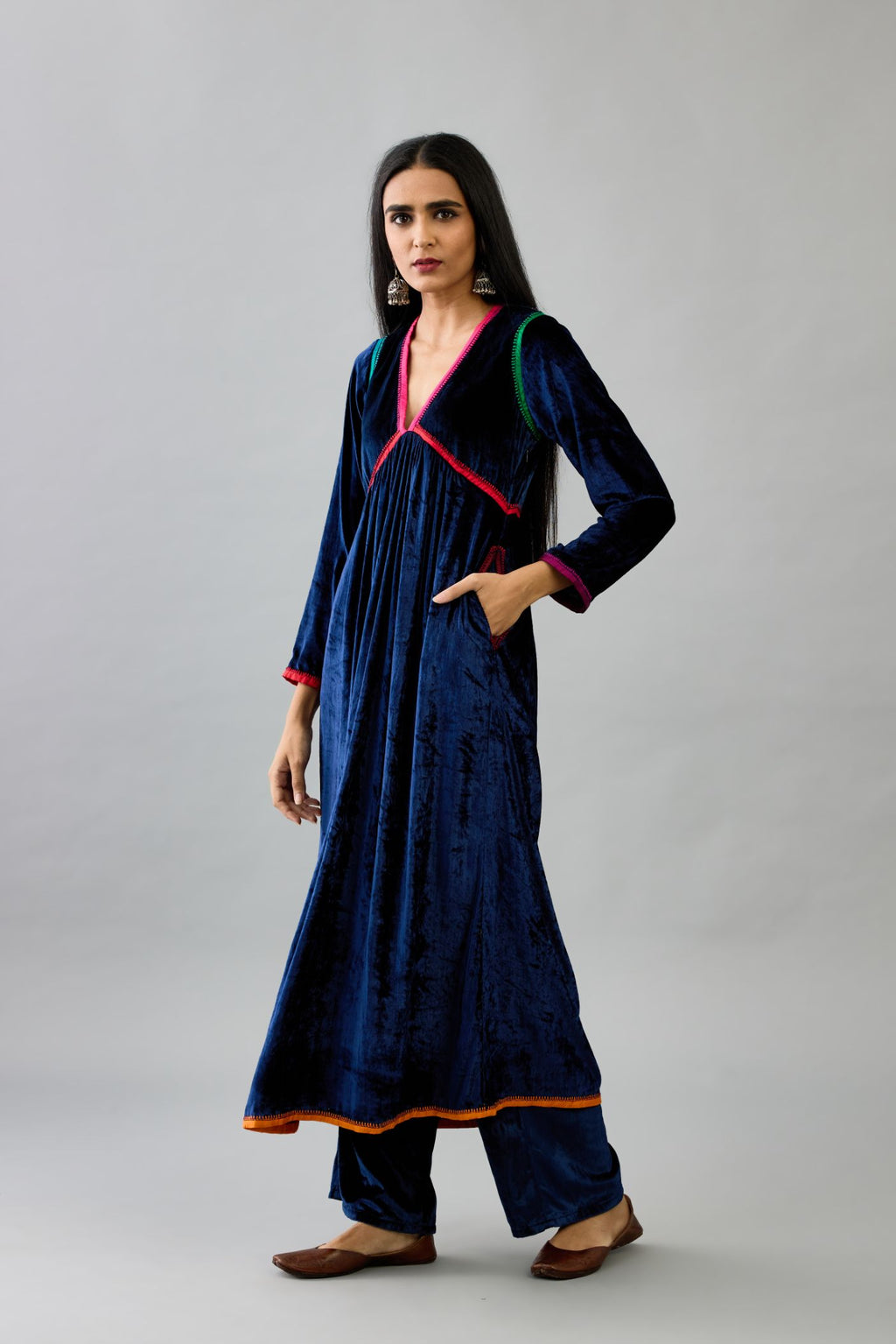 Blue silk velvet kurta dress set with multi colored silk facing and embroidery details.