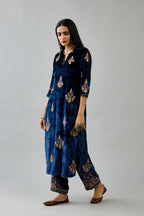 Blue silk velvet straight kurta set with zari, dori and contrast silk thread embroidered bootas, highlighted with gold sequins work.