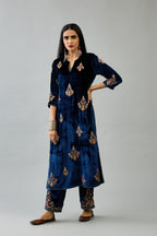 Blue silk velvet straight kurta set with zari, dori and contrast silk thread embroidered bootas, highlighted with gold sequins work.