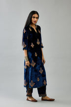 Blue silk velvet straight kurta set with zari, dori and contrast silk thread embroidered bootas, highlighted with gold sequins work.