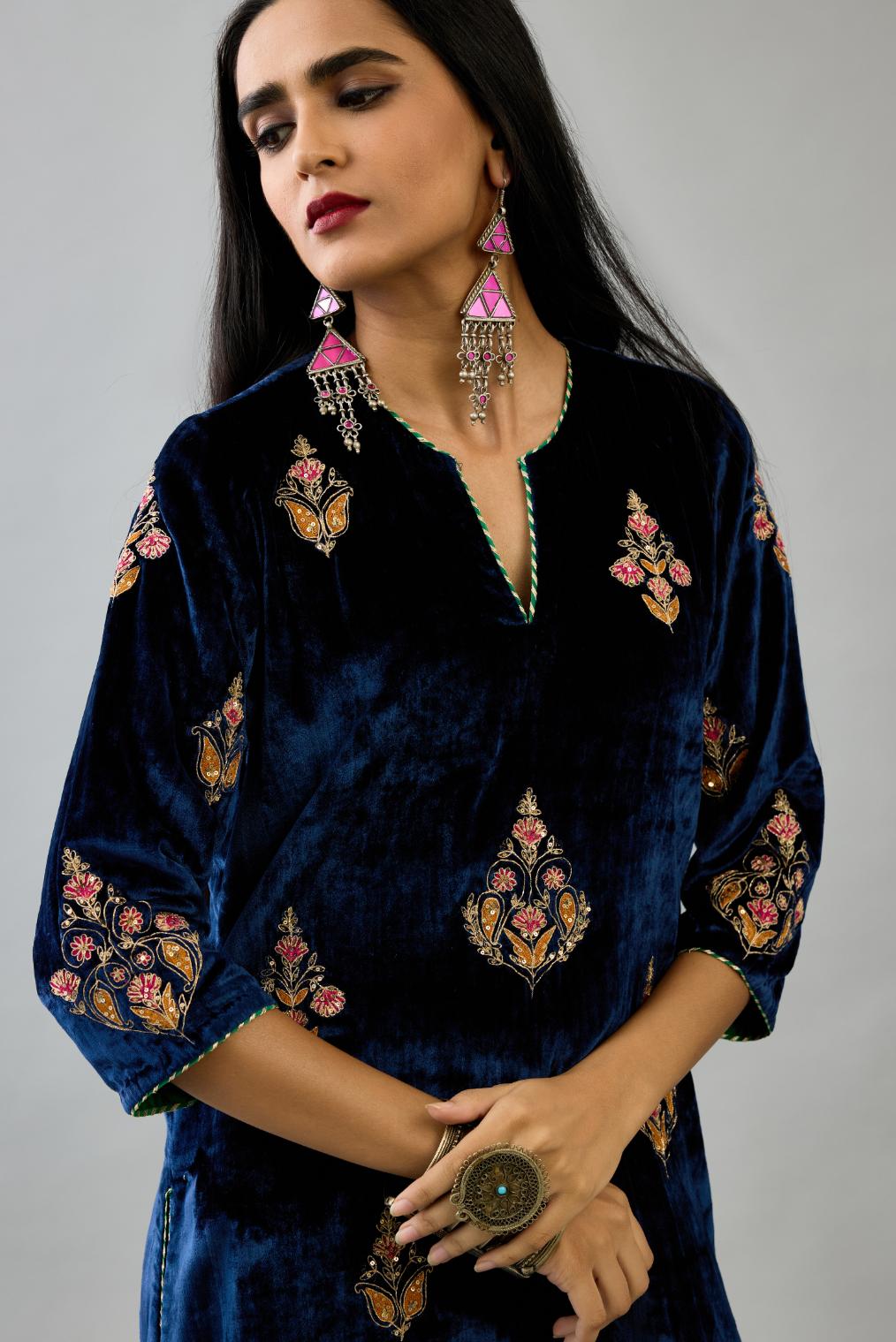 Blue silk velvet straight kurta set with zari, dori and contrast silk thread embroidered bootas, highlighted with gold sequins work.