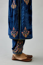 Blue silk velvet straight kurta set with zari, dori and contrast silk thread embroidered bootas, highlighted with gold sequins work.