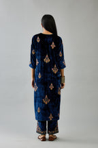 Blue silk velvet straight kurta set with zari, dori and contrast silk thread embroidered bootas, highlighted with gold sequins work.