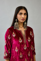 Fuchsia silk velvet A-line short kurta set with dori and contrast silk thread embroidery, highlighted with gold sequins work.
