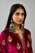 Fuchsia silk velvet A-line short kurta set with dori and contrast silk thread embroidery, highlighted with gold sequins work.