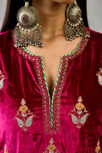 Fuchsia silk velvet A-line short kurta set with dori and contrast silk thread embroidery, highlighted with gold sequins work.