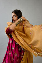 Golden yellow tissue chanderi dupatta in chevron pattern embroidery with contrast silk thread and dori at the sides.
