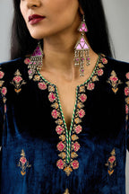 Blue silk velvet straight kurta set with all-over zari, dori and contrast silk thread embroidery, highlighted with gold sequins work.