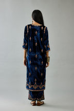 Blue silk velvet straight kurta set with all-over zari, dori and contrast silk thread embroidery, highlighted with gold sequins work.
