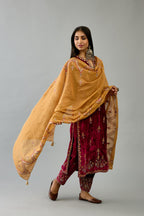 Golden yellow tissue chanderi dupatta in chevron pattern embroidery with contrast silk thread and dori at the sides.