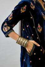 Blue silk velvet A-line short kurta set with dori and contrast silk thread embroidery, highlighted with gold sequins work.