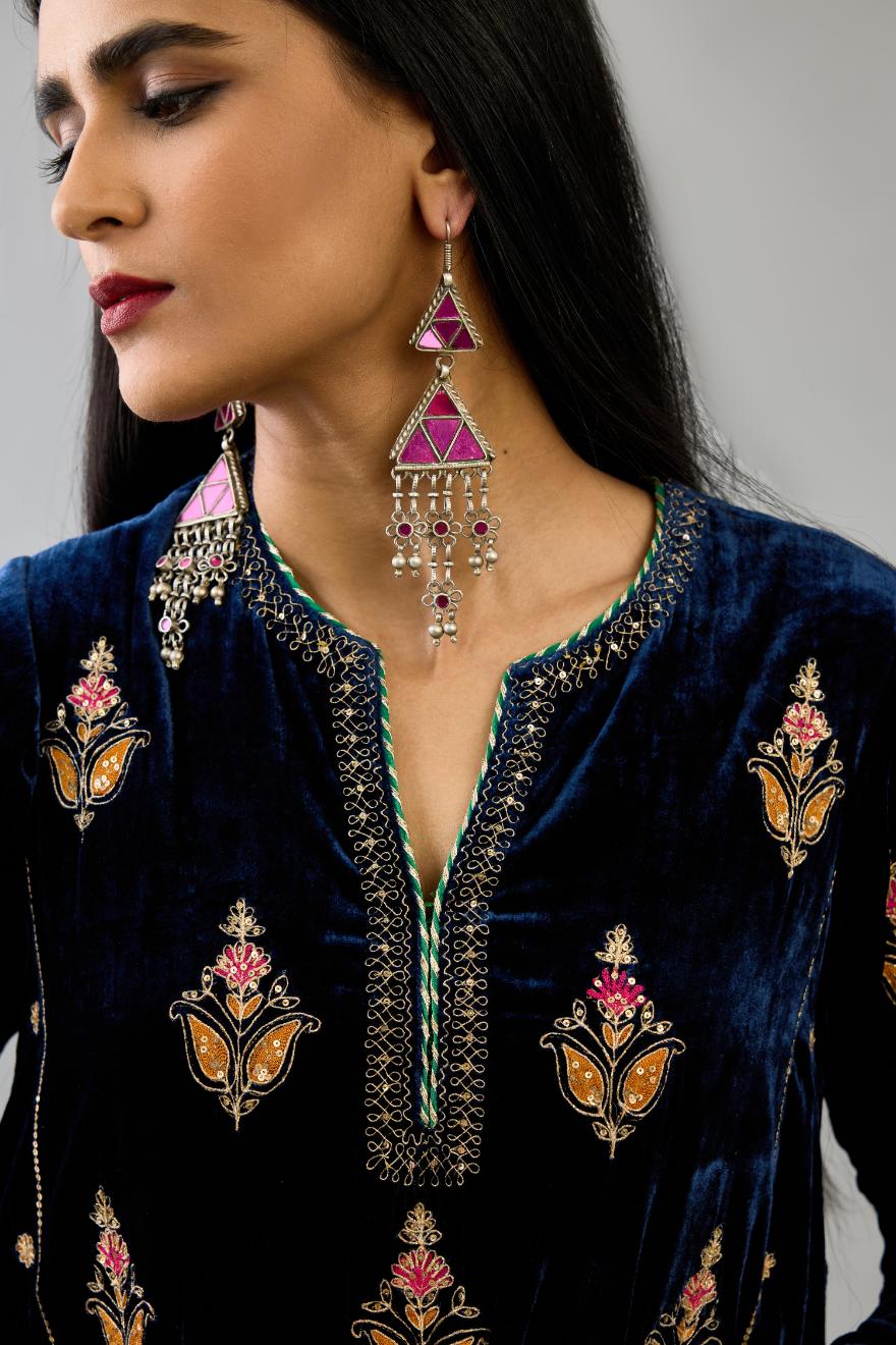 Blue silk velvet A-line short kurta set with dori and contrast silk thread embroidery, highlighted with gold sequins work.