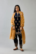 Blue silk velvet A-line short kurta set with dori and contrast silk thread embroidery, highlighted with gold sequins work.
