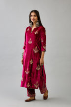 Fuchsia silk velvet straight kurta set with zari, dori and contrast silk thread embroidered bootas, highlighted with gold sequins work.