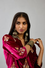 Fuchsia silk velvet straight kurta set with zari, dori and contrast silk thread embroidered bootas, highlighted with gold sequins work.