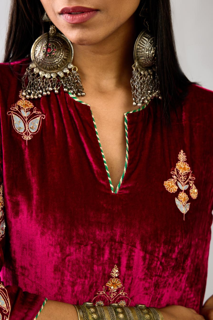 Fuchsia silk velvet straight kurta set with zari, dori and contrast silk thread embroidered bootas, highlighted with gold sequins work.