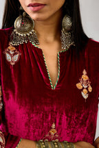 Fuchsia silk velvet straight kurta set with zari, dori and contrast silk thread embroidered bootas, highlighted with gold sequins work.