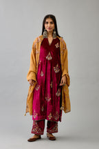 Fuchsia silk velvet straight kurta set with zari, dori and contrast silk thread embroidered bootas, highlighted with gold sequins work.