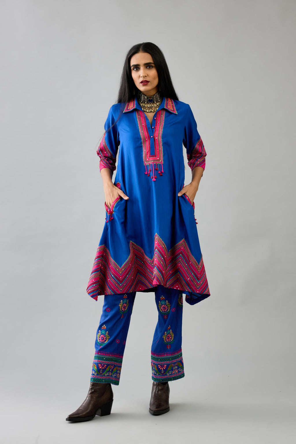 Blue Silk A-line kurta with collar, detailed with patchwork, silk thread embroidery, mirrors, sequins and tassels.