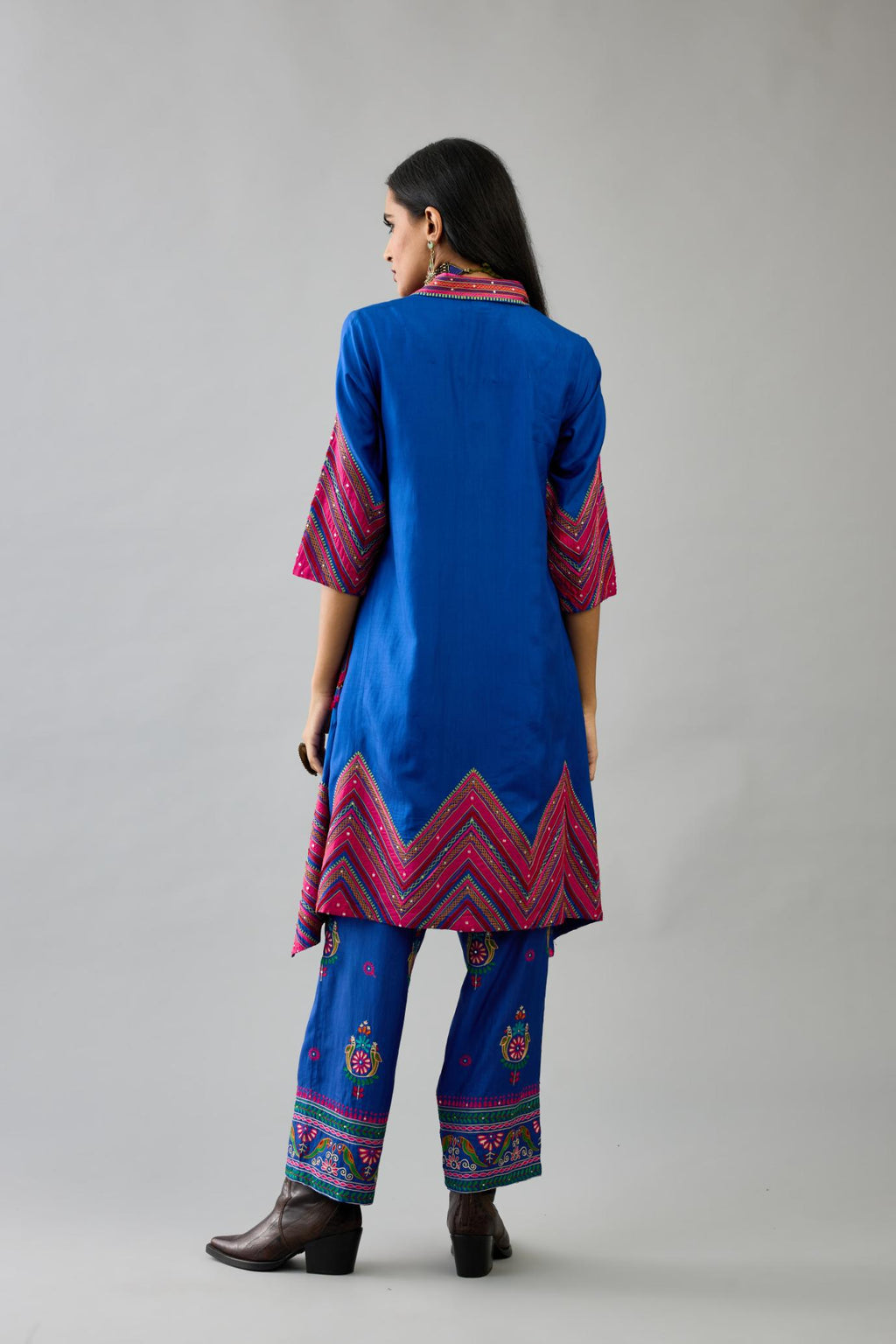 Blue Silk A-line kurta with collar, detailed with patchwork, silk thread embroidery, mirrors, sequins and tassels.