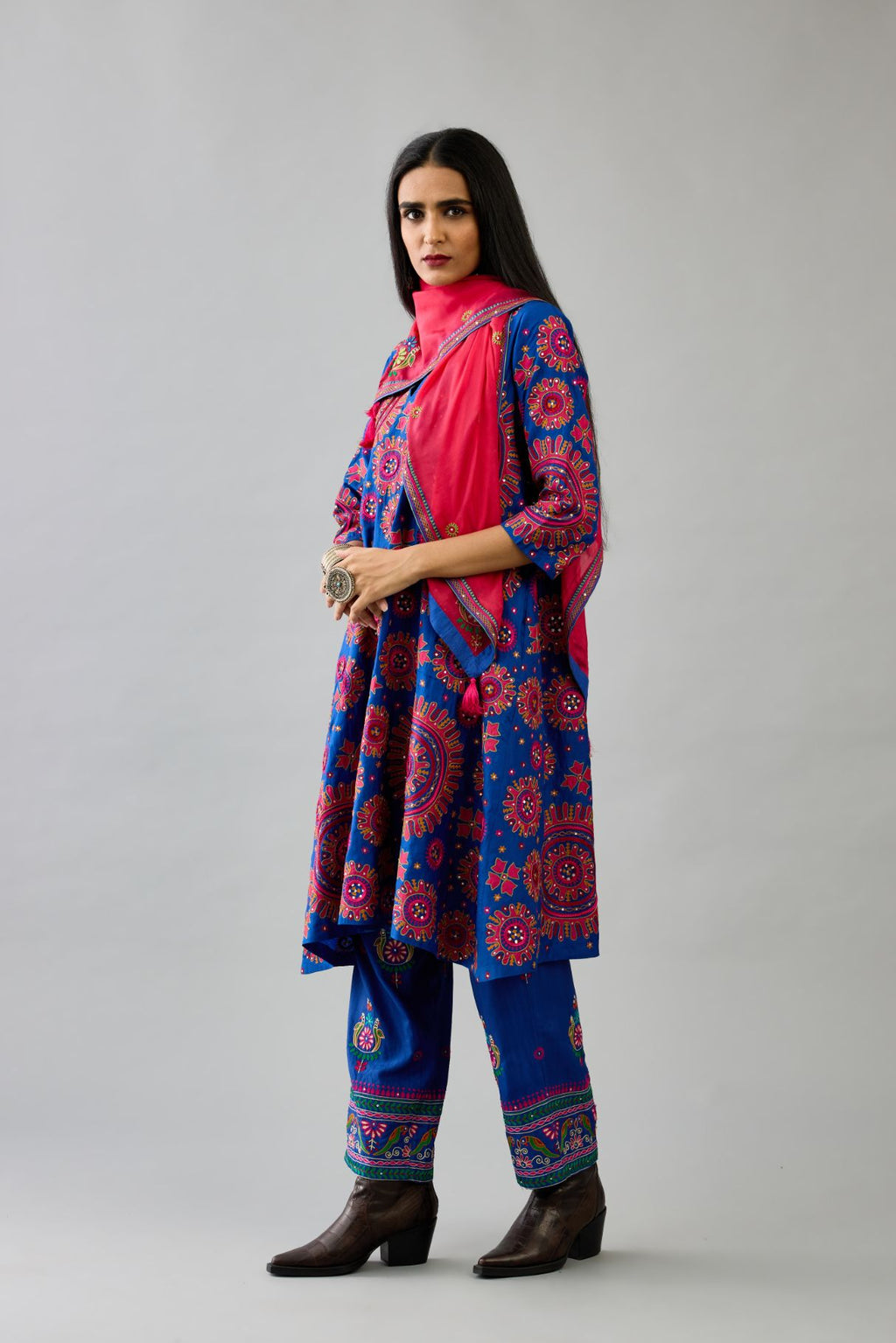 Blue A-line silk kurta set with all over patchwork, silk thread, mirror, tassels and sequin embroidery.
