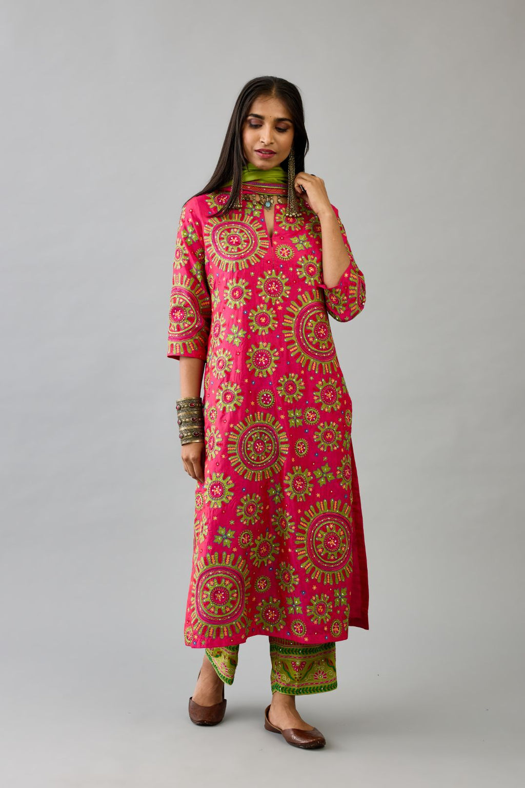 Fuchsia silk straight kurta set with all over patchwork, silk thread, mirror, tassels and sequins embroidery.