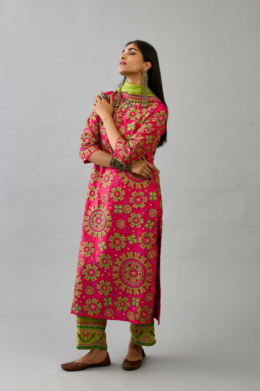 Fuchsia silk straight kurta set with all over patchwork, silk thread, mirror, tassels and sequins embroidery.