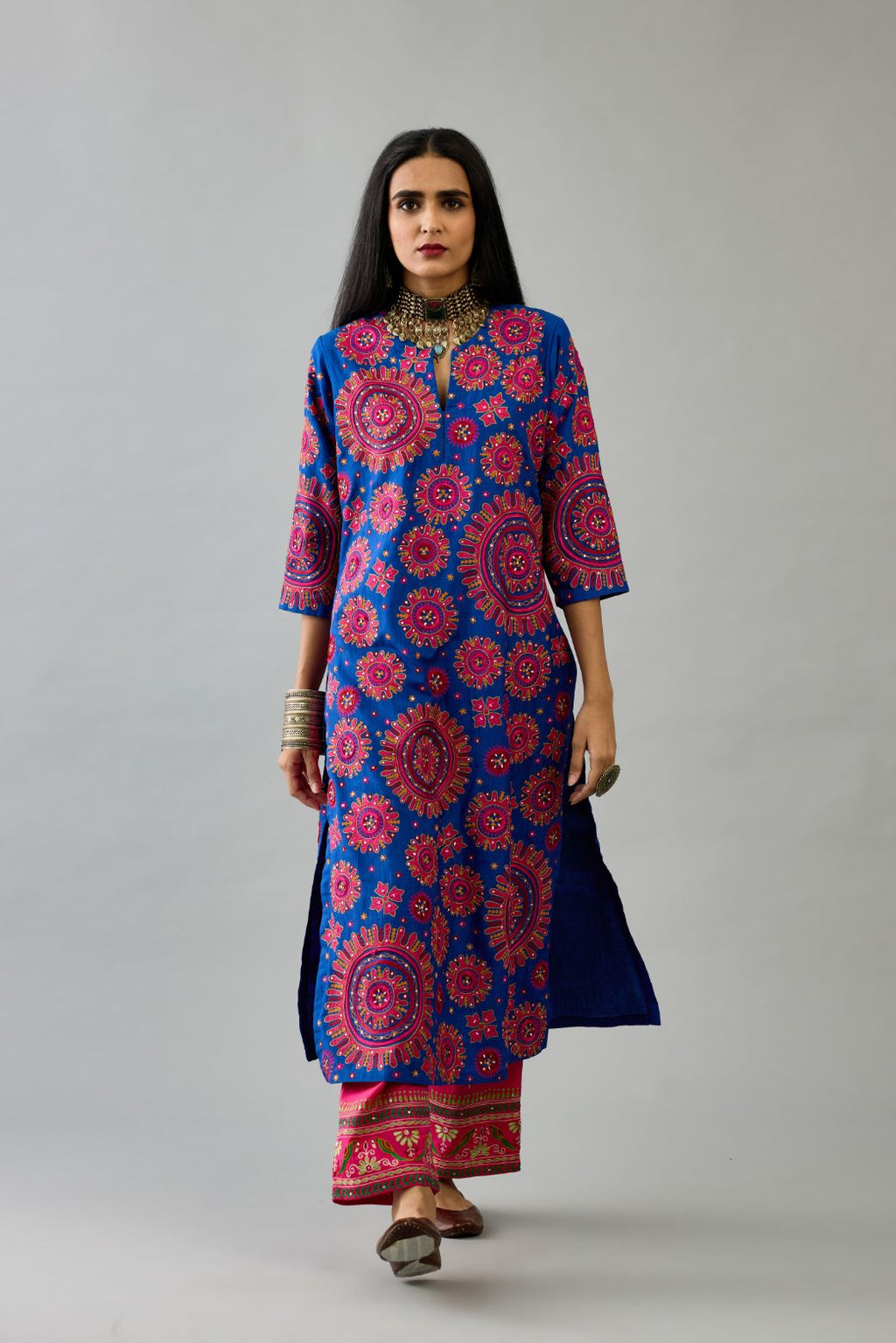 Blue silk straight kurta set with all over patchwork, silk thread, mirror, tassels and sequins embroidery.