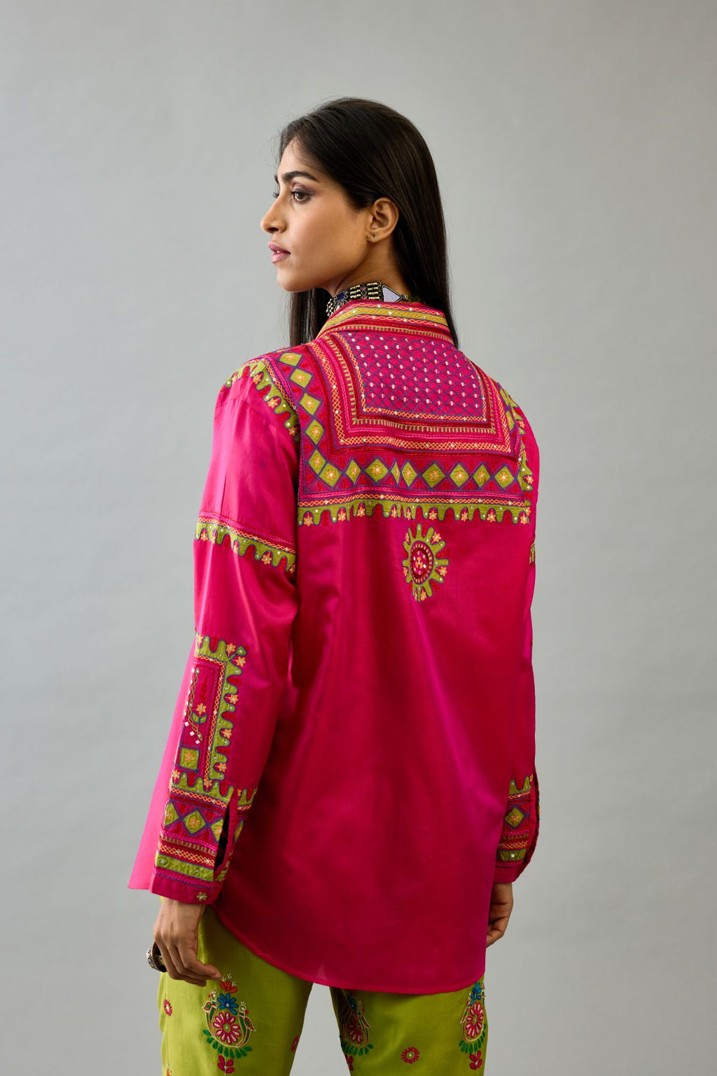 Fuchsia silk embroidered shirt set with full sleeves.