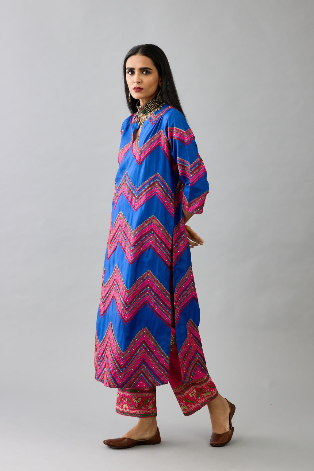 Blue silk straight kurta set with all over chevron pattern. It is embellished with silk patchwork, thread, sequins and mirrors.