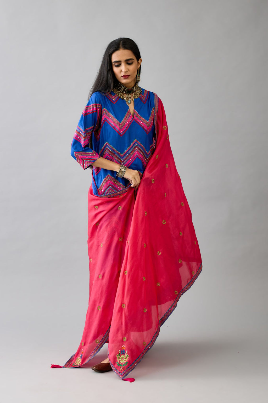 Blue silk straight kurta set with all over chevron pattern. It is embellished with silk patchwork, thread, sequins and mirrors.