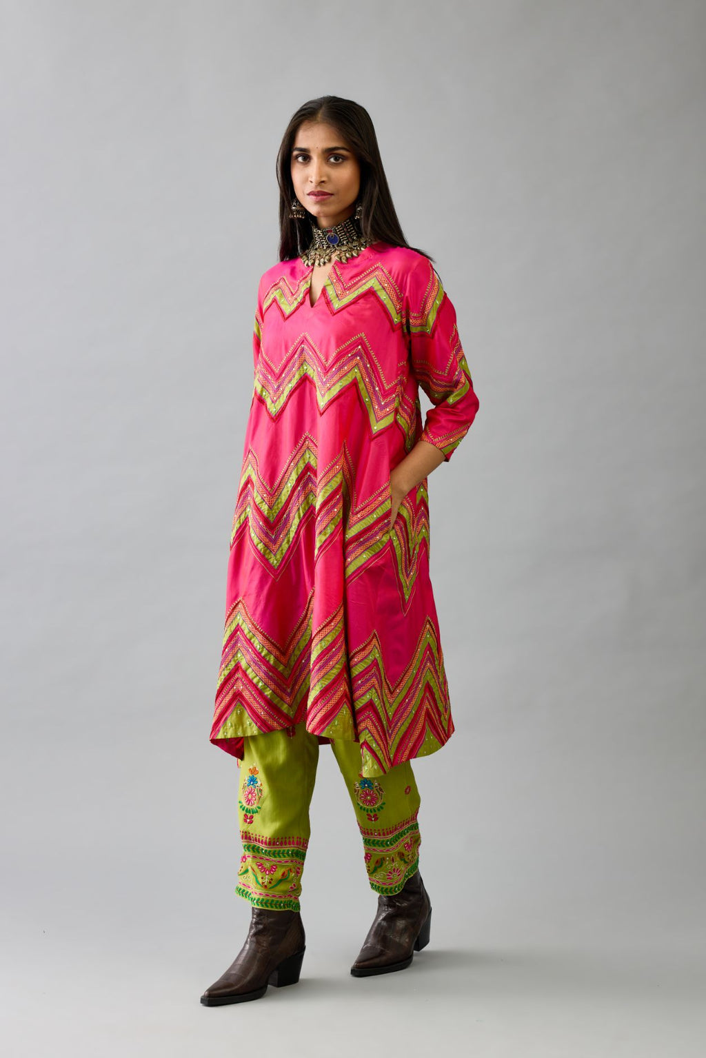 Fuchsia silk A-line  kurta set with all over embroidery set in bold chevron stripes.