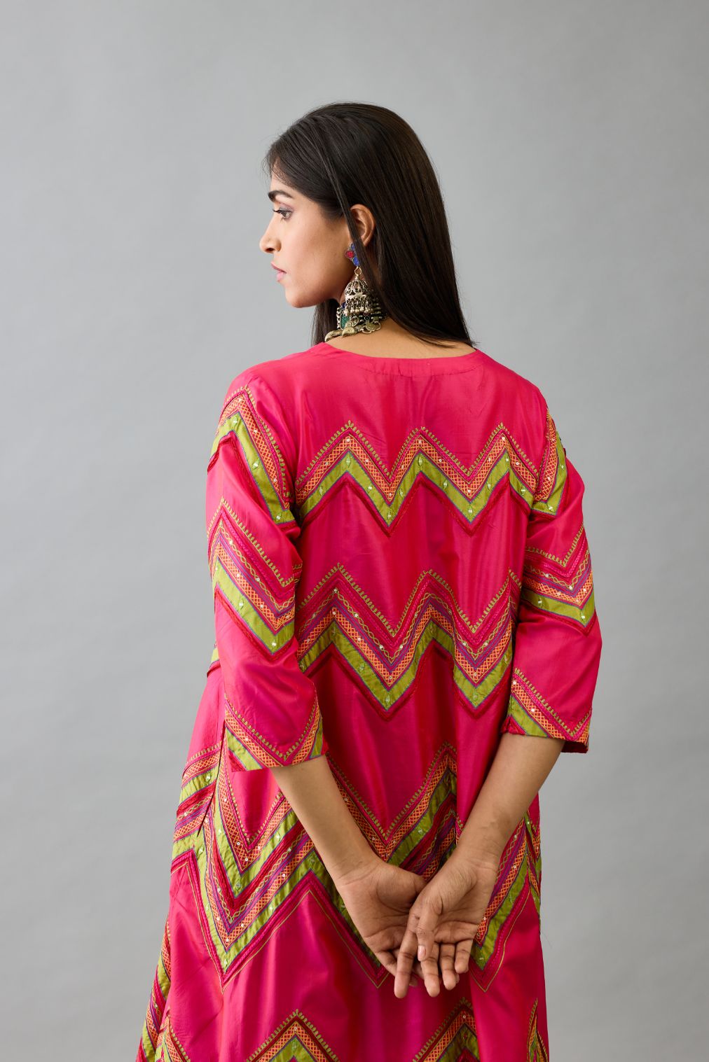 Fuchsia silk A-line  kurta set with all over embroidery set in bold chevron stripes.