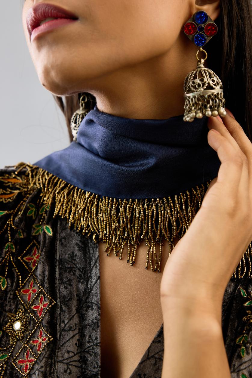 Grey silk velvet hand block printed easy fit dress with, highlighted with beads, sequins and zari work, paired with blue light silk narrow stole with bugle beads fringes.