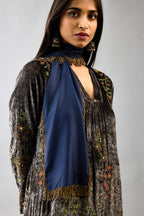 Grey silk velvet hand block printed easy fit dress with, highlighted with beads, sequins and zari work, paired with blue light silk narrow stole with bugle beads fringes.