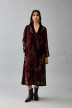 Maroon silk velvet hand block printed easy fit dress with, highlighted with beads, sequins and zari work, paired with green light silk narrow stole with bugle beads fringes.