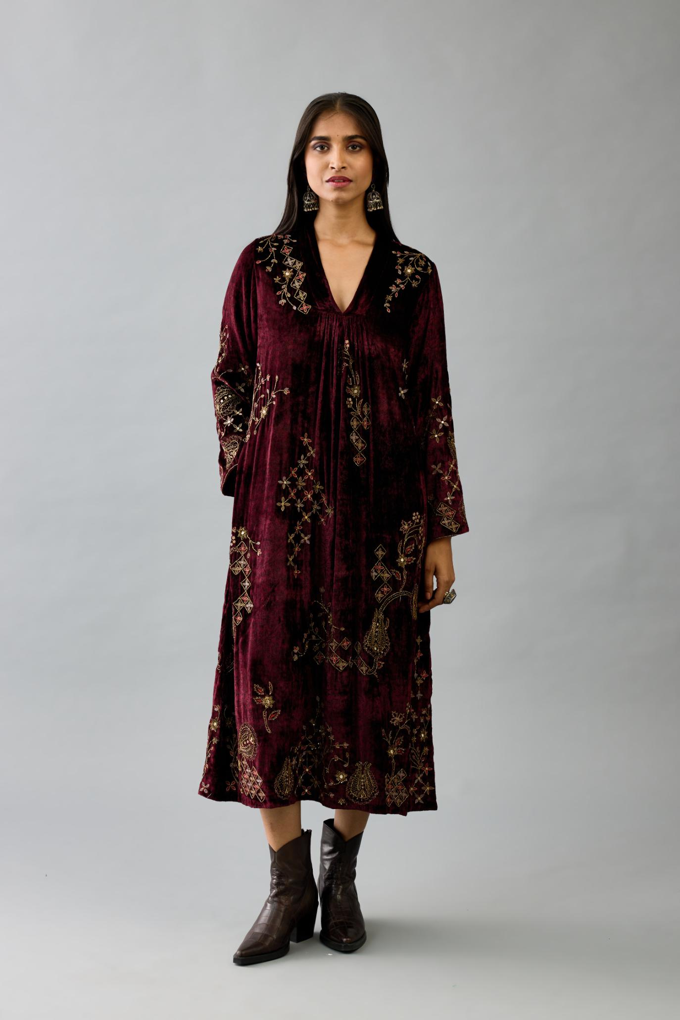 Maroon silk velvet hand block printed easy fit dress with, highlighted with beads, sequins and zari work, paired with green light silk narrow stole with bugle beads fringes.