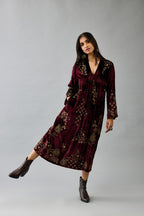 Maroon silk velvet hand block printed easy fit dress with, highlighted with beads, sequins and zari work, paired with green light silk narrow stole with bugle beads fringes.