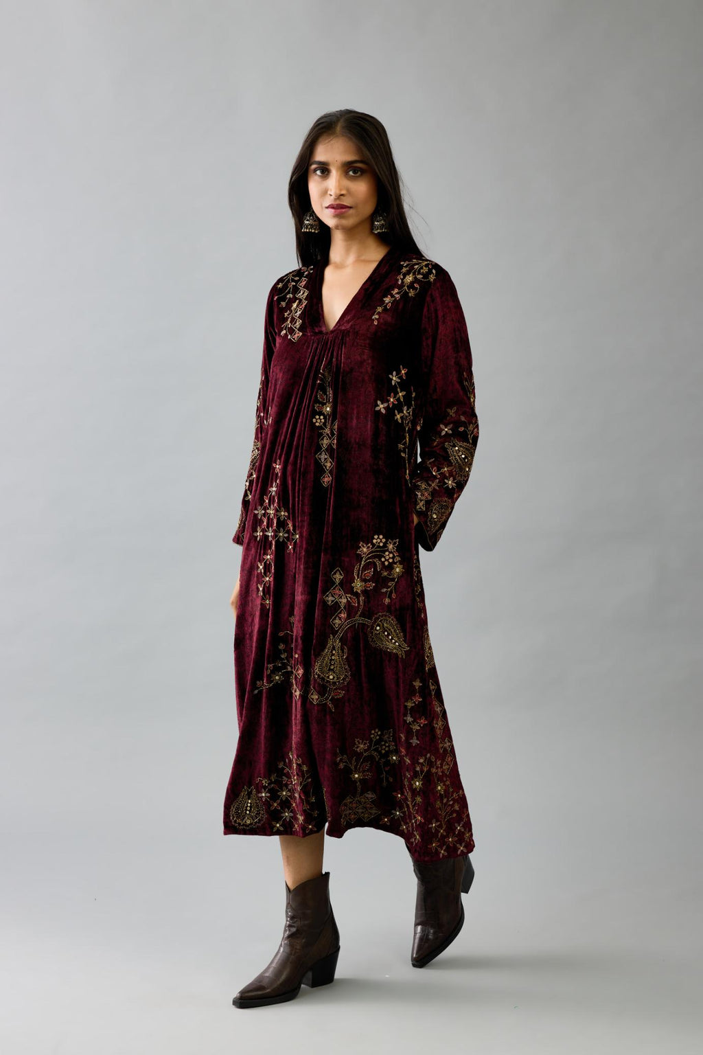Maroon silk velvet hand block printed easy fit dress with, highlighted with beads, sequins and zari work, paired with green light silk narrow stole with bugle beads fringes.