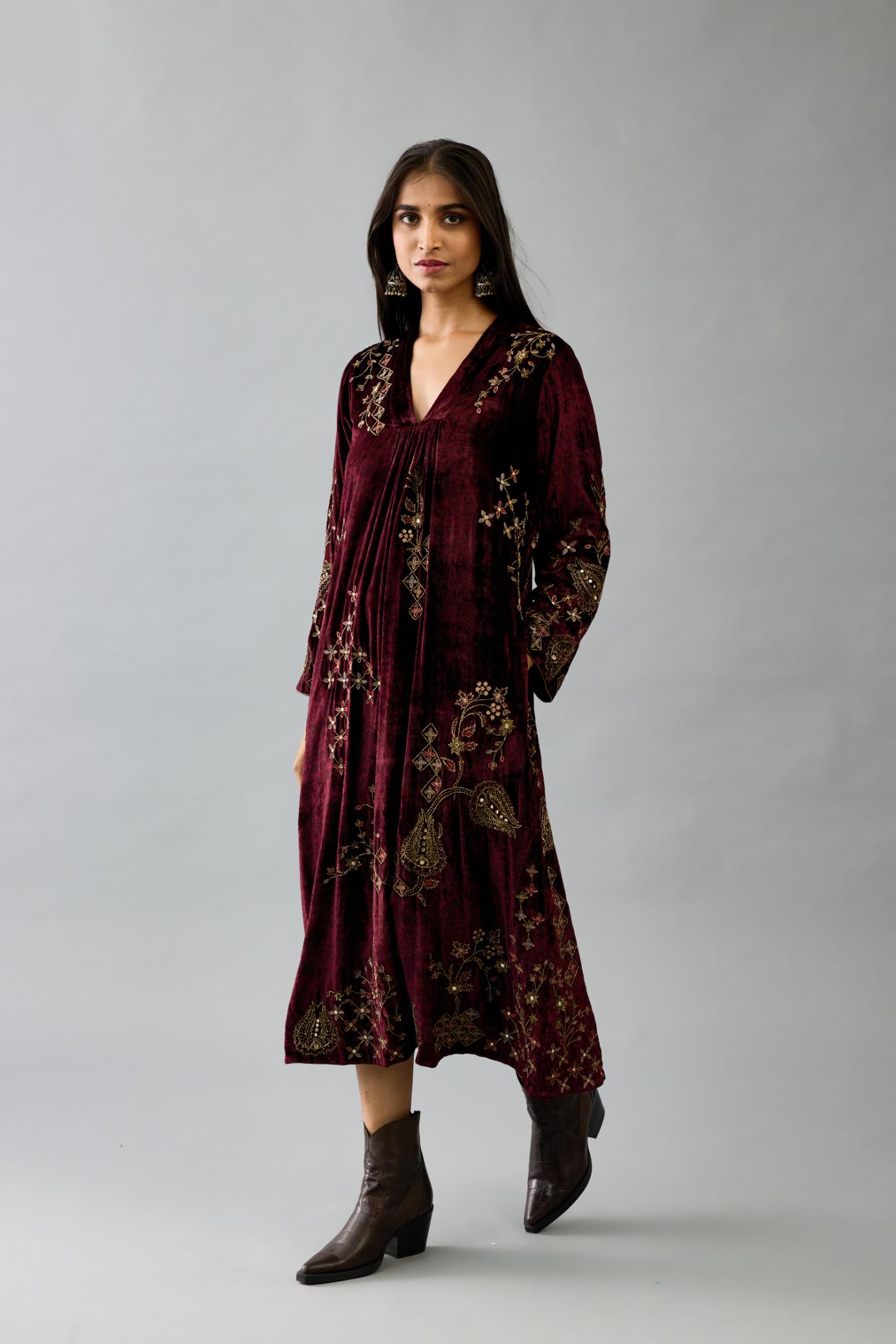 Maroon silk velvet hand block printed easy fit dress with, highlighted with beads, sequins and zari work, paired with green light silk narrow stole with bugle beads fringes.