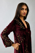 Maroon silk velvet hand block printed easy fit dress with, highlighted with beads, sequins and zari work, paired with green light silk narrow stole with bugle beads fringes.