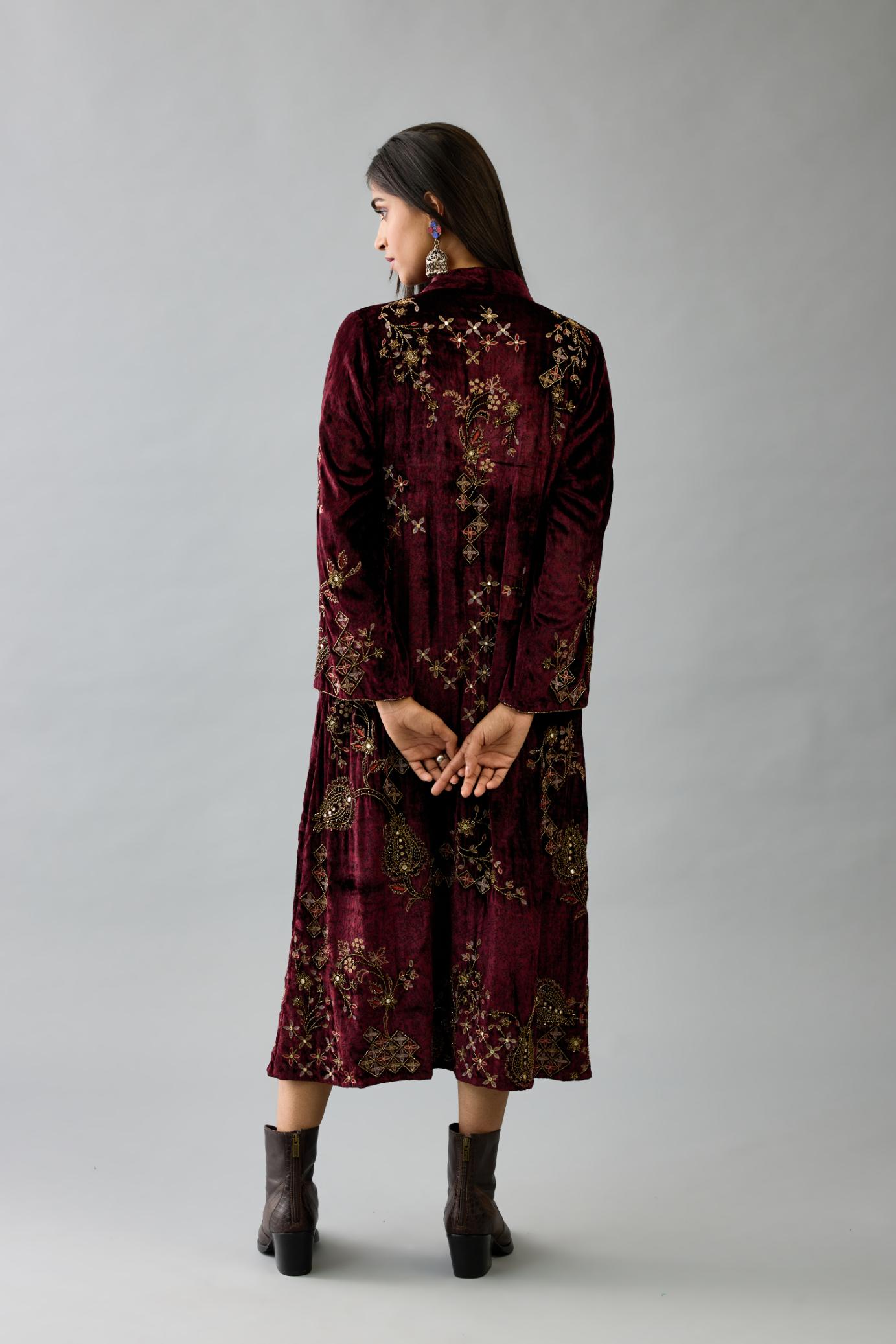 Maroon silk velvet hand block printed easy fit dress with, highlighted with beads, sequins and zari work, paired with green light silk narrow stole with bugle beads fringes.