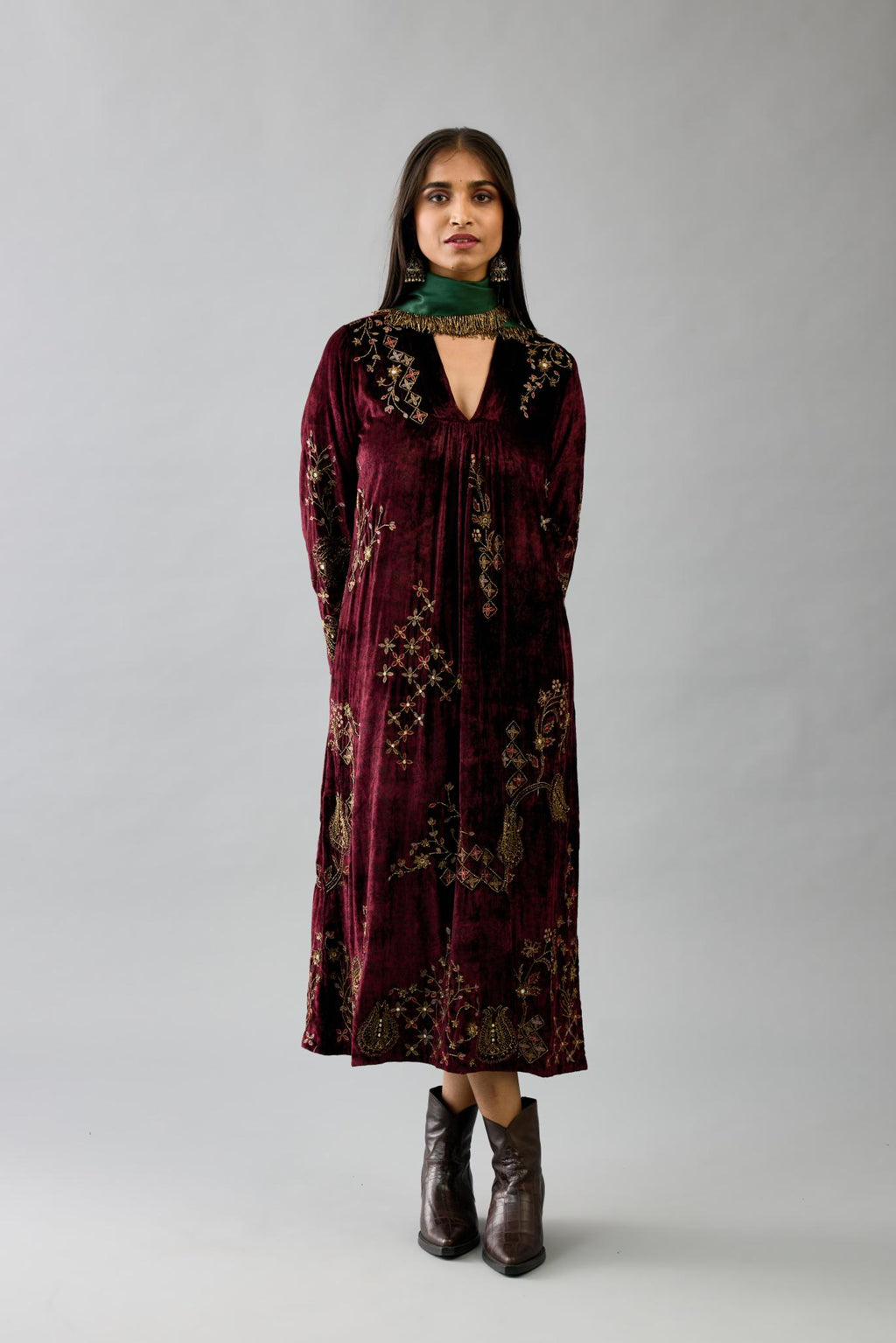 Maroon silk velvet hand block printed easy fit dress with, highlighted with beads, sequins and zari work, paired with green light silk narrow stole with bugle beads fringes.