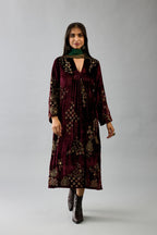 Maroon silk velvet hand block printed easy fit dress with, highlighted with beads, sequins and zari work, paired with green light silk narrow stole with bugle beads fringes.