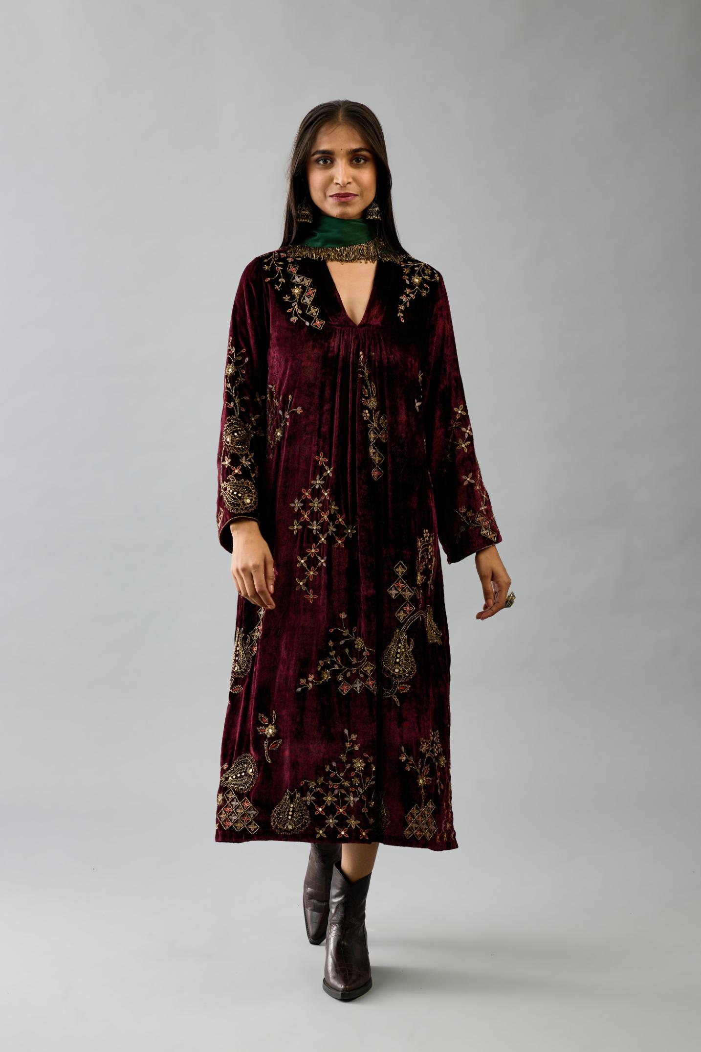 Maroon silk velvet hand block printed easy fit dress with, highlighted with beads, sequins and zari work, paired with green light silk narrow stole with bugle beads fringes.