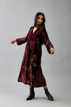 Maroon silk velvet hand block printed easy fit dress with, highlighted with beads, sequins and zari work, paired with green light silk narrow stole with bugle beads fringes.