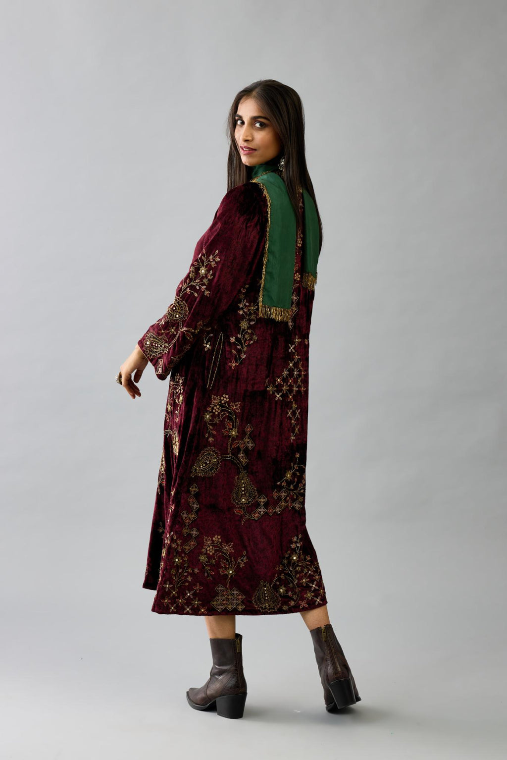 Maroon silk velvet hand block printed easy fit dress with, highlighted with beads, sequins and zari work, paired with green light silk narrow stole with bugle beads fringes.