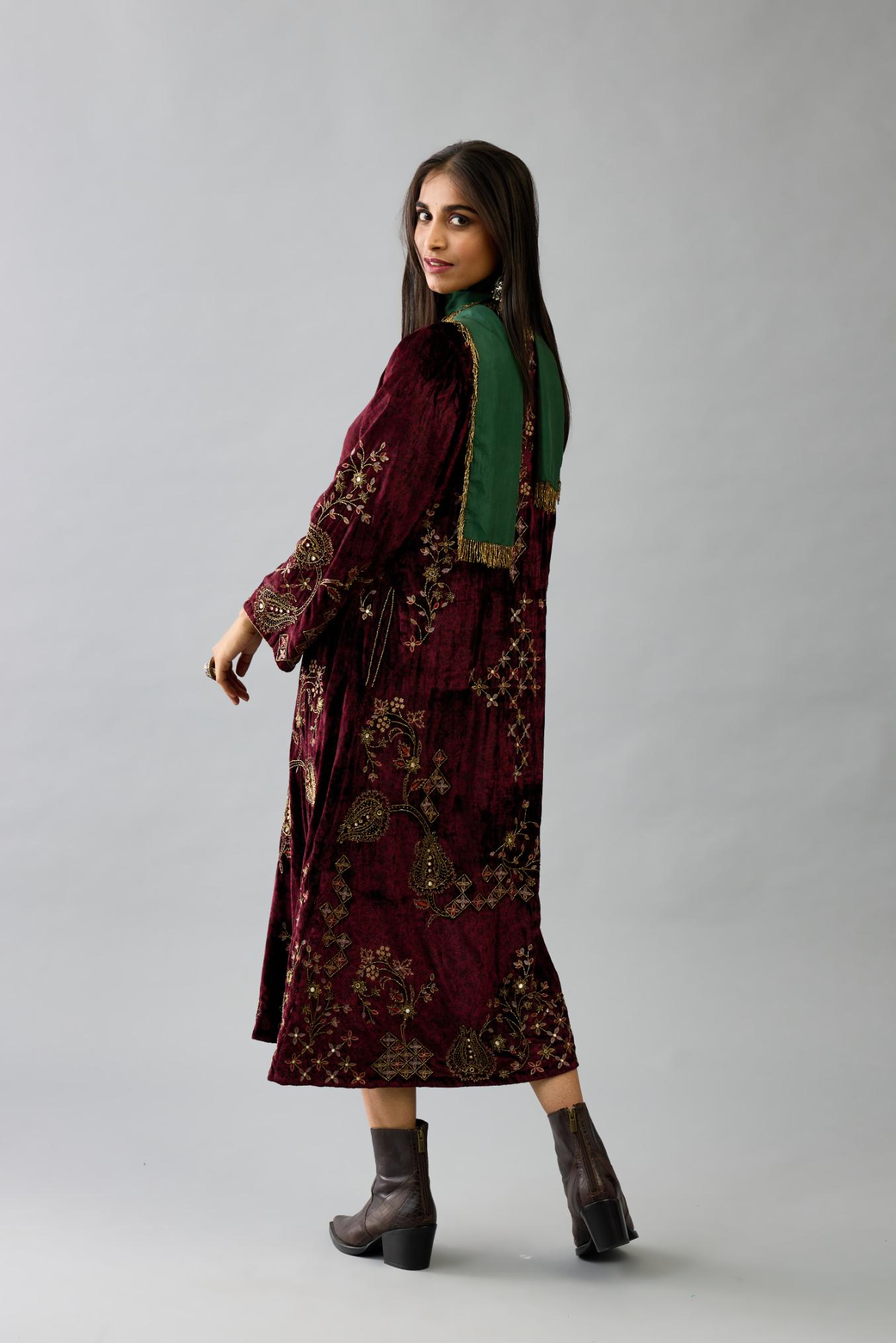 Maroon silk velvet hand block printed easy fit dress with, highlighted with beads, sequins and zari work, paired with green light silk narrow stole with bugle beads fringes.