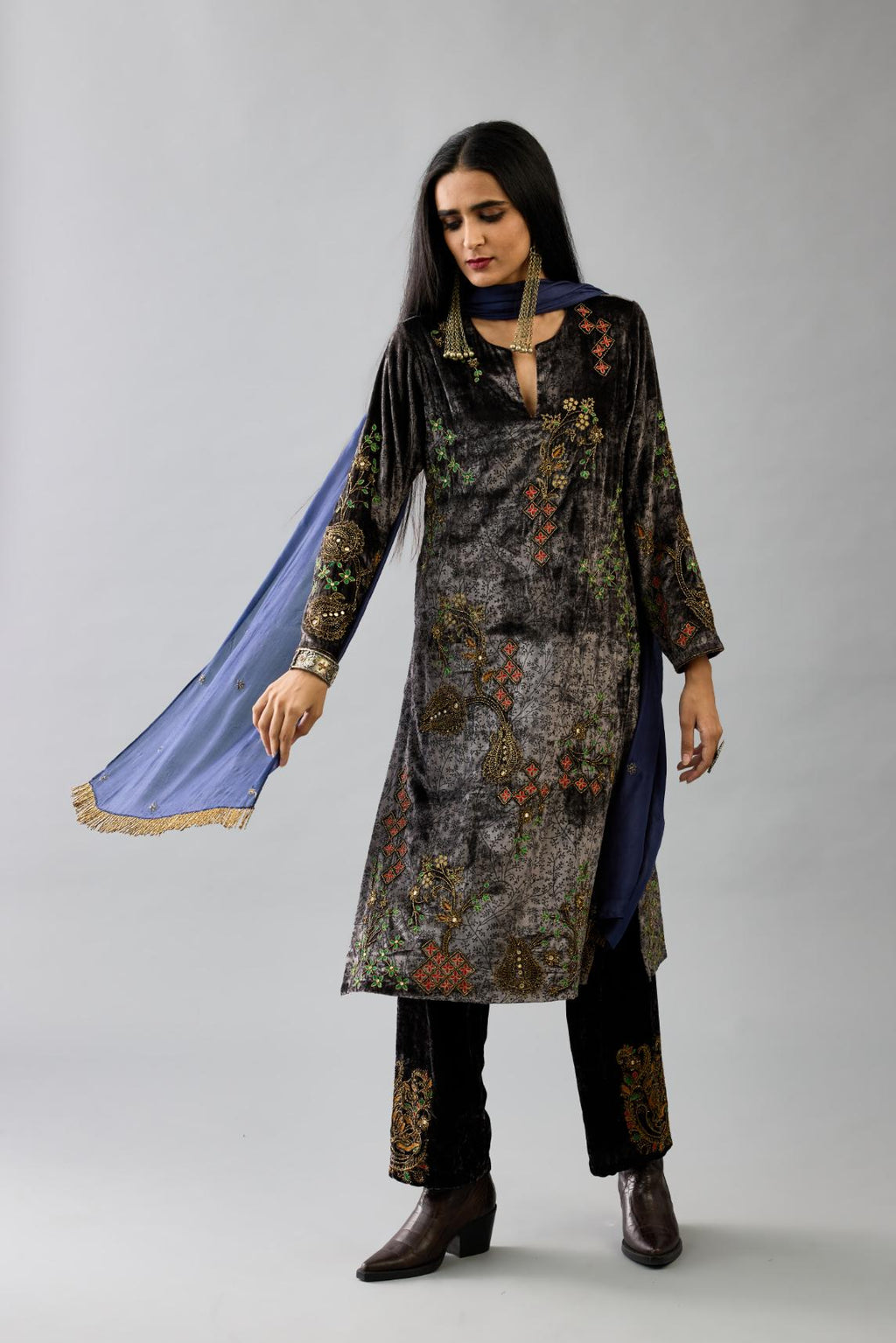 Blue light silk stole with all-over small embroidered booti and fringes at sides.