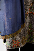 Blue light silk stole with all-over small embroidered booti and fringes at sides.